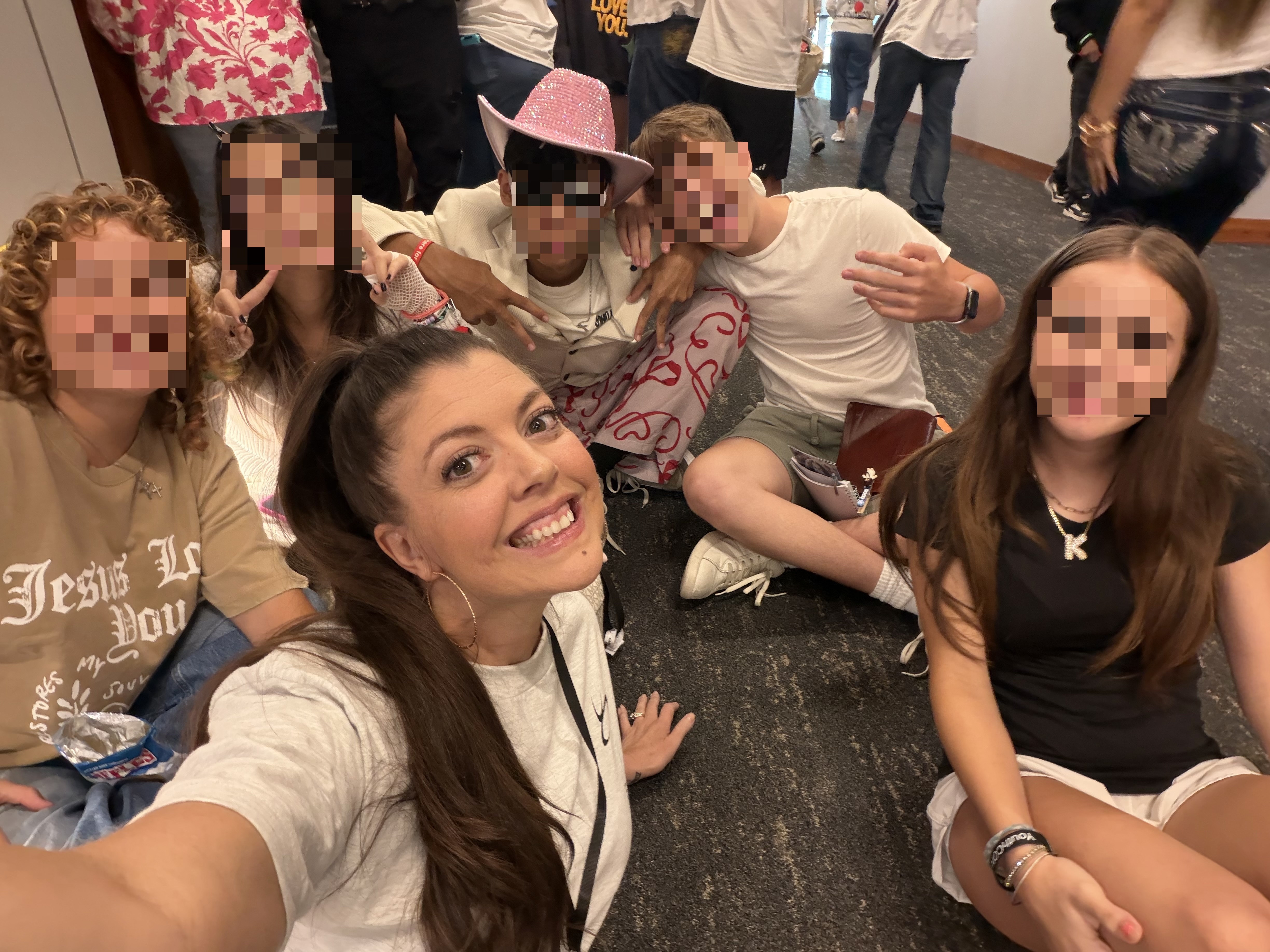 Melissa with her youth group at this year's conference, faces of the teens blurred for privacy